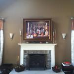 LCD with Leon LCR Speaker Above Fireplace Hidden by Automated Artwork that rolls up when TV is Activated